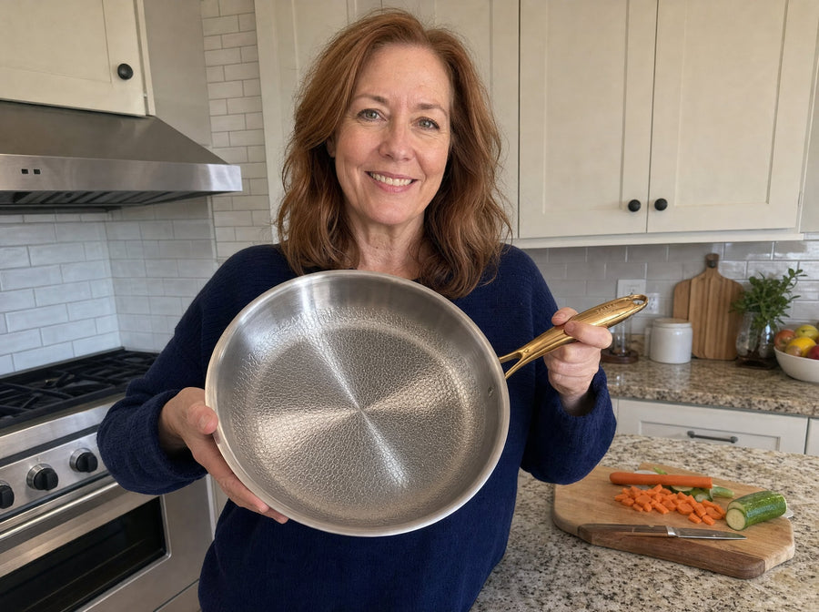 Customer holding her Taima pan in her kitchen