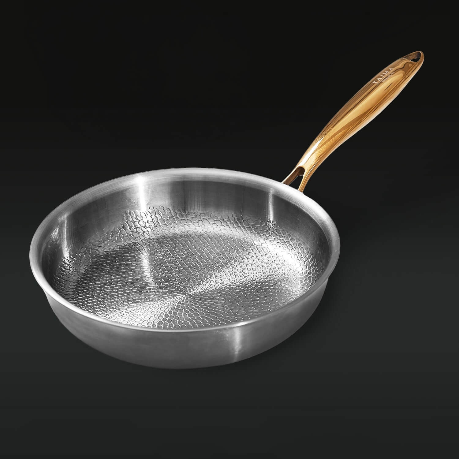 Silver frying pan with a wooden handle on a black background