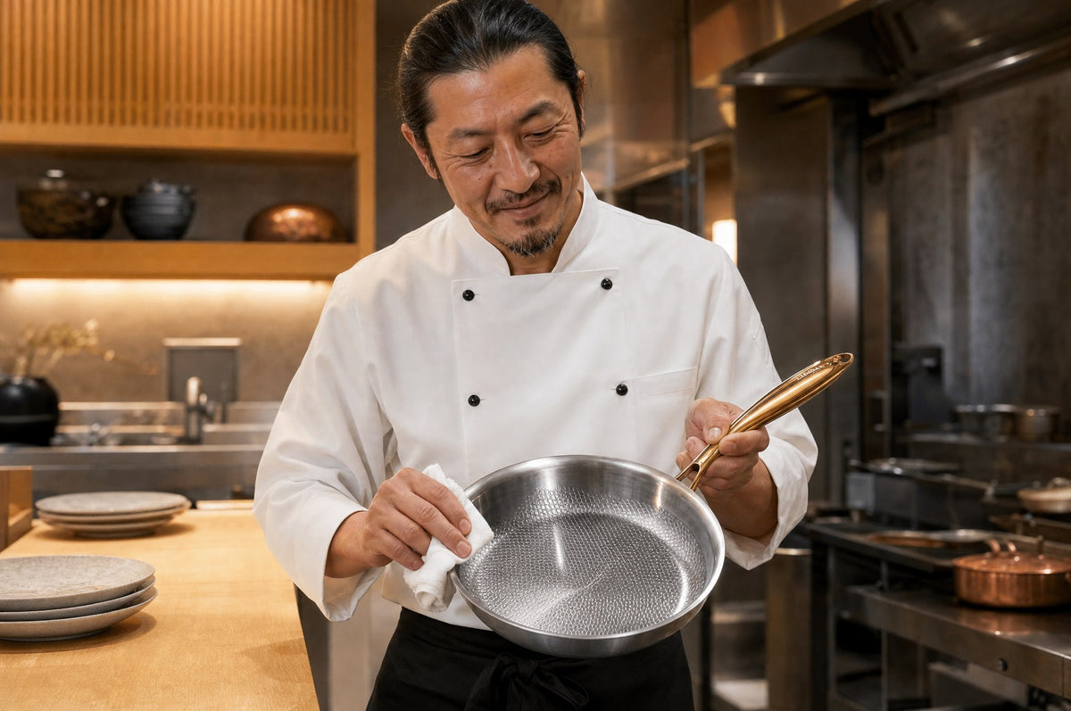 Chef polishing his Taima pan at the end of service